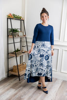 Model modeling Nuggles® Charay Dress with ¾ sleeves and high-low hem. Modest and stylish A-line dress with flattering fit.