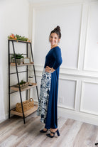 Model modeling Nuggles® Charay Dress with ¾ sleeves and high-low hem. Modest and stylish A-line dress with flattering fit.