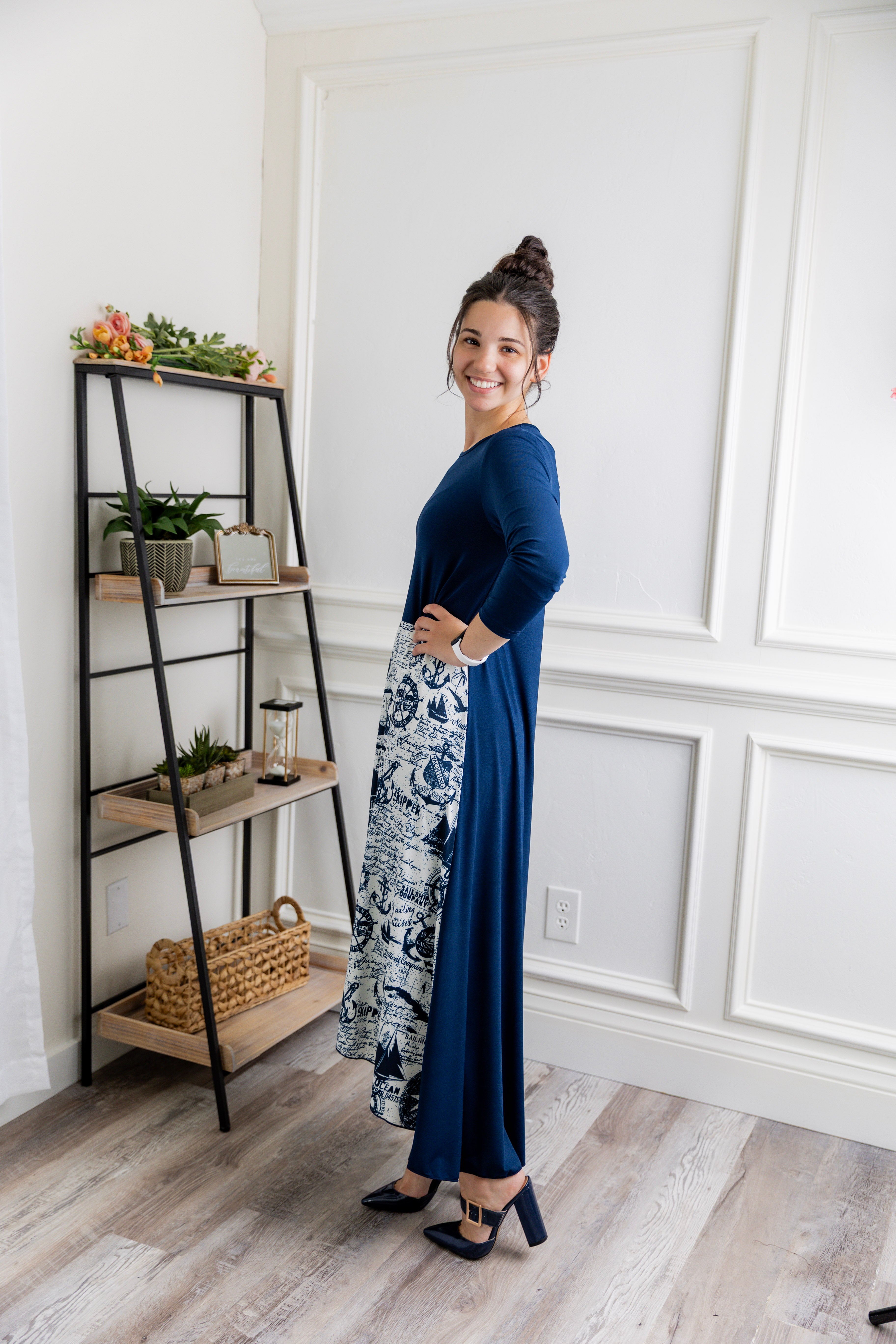 Model modeling Nuggles® Charay Dress with ¾ sleeves and high-low hem. Modest and stylish A-line dress with flattering fit.