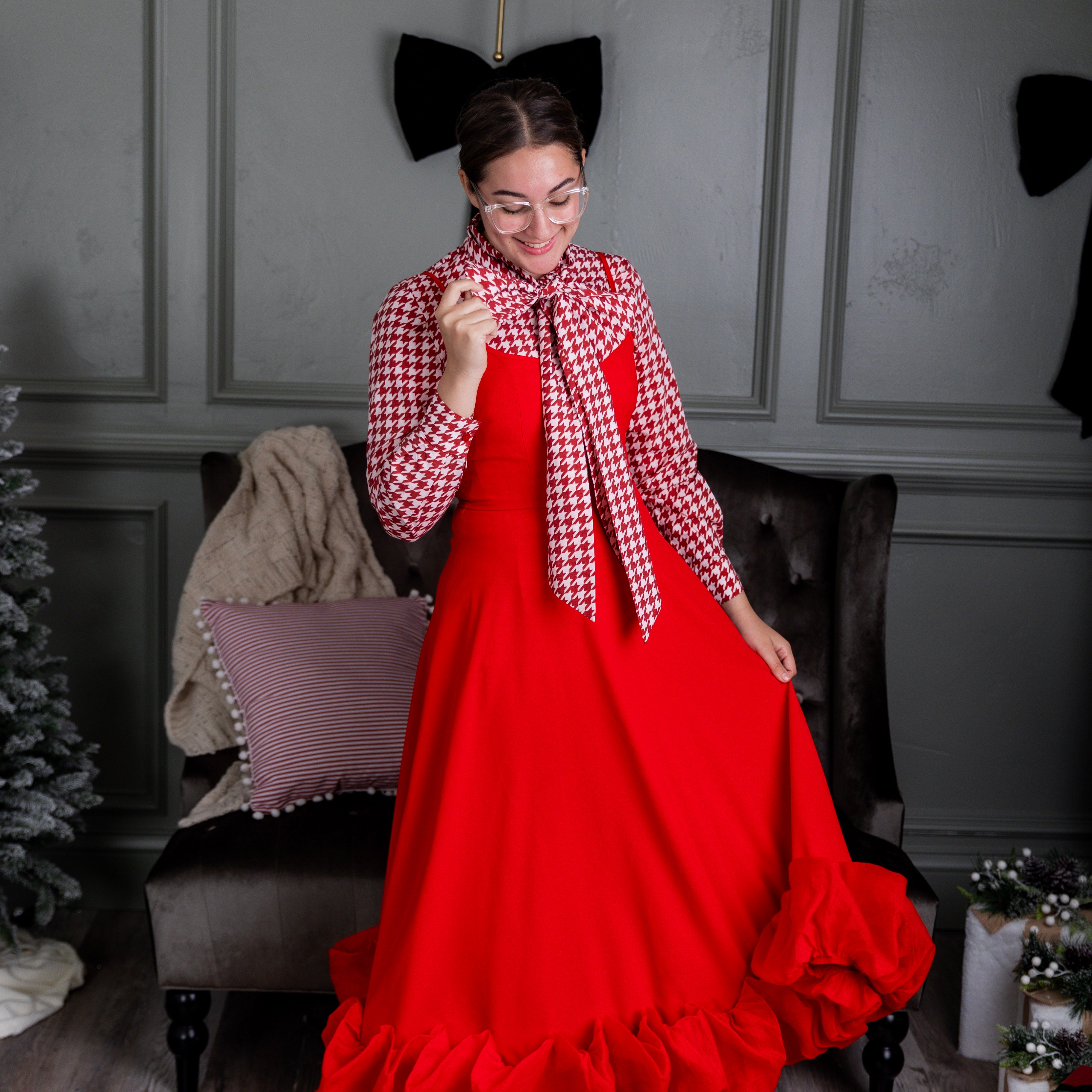 Model wearing Nuggles® Felicity top with large bow tie neckline, modest women's blouse.