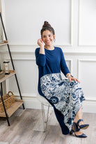 Model modeling Nuggles® Charay Dress with ¾ sleeves and high-low hem. Modest and stylish A-line dress with flattering fit.