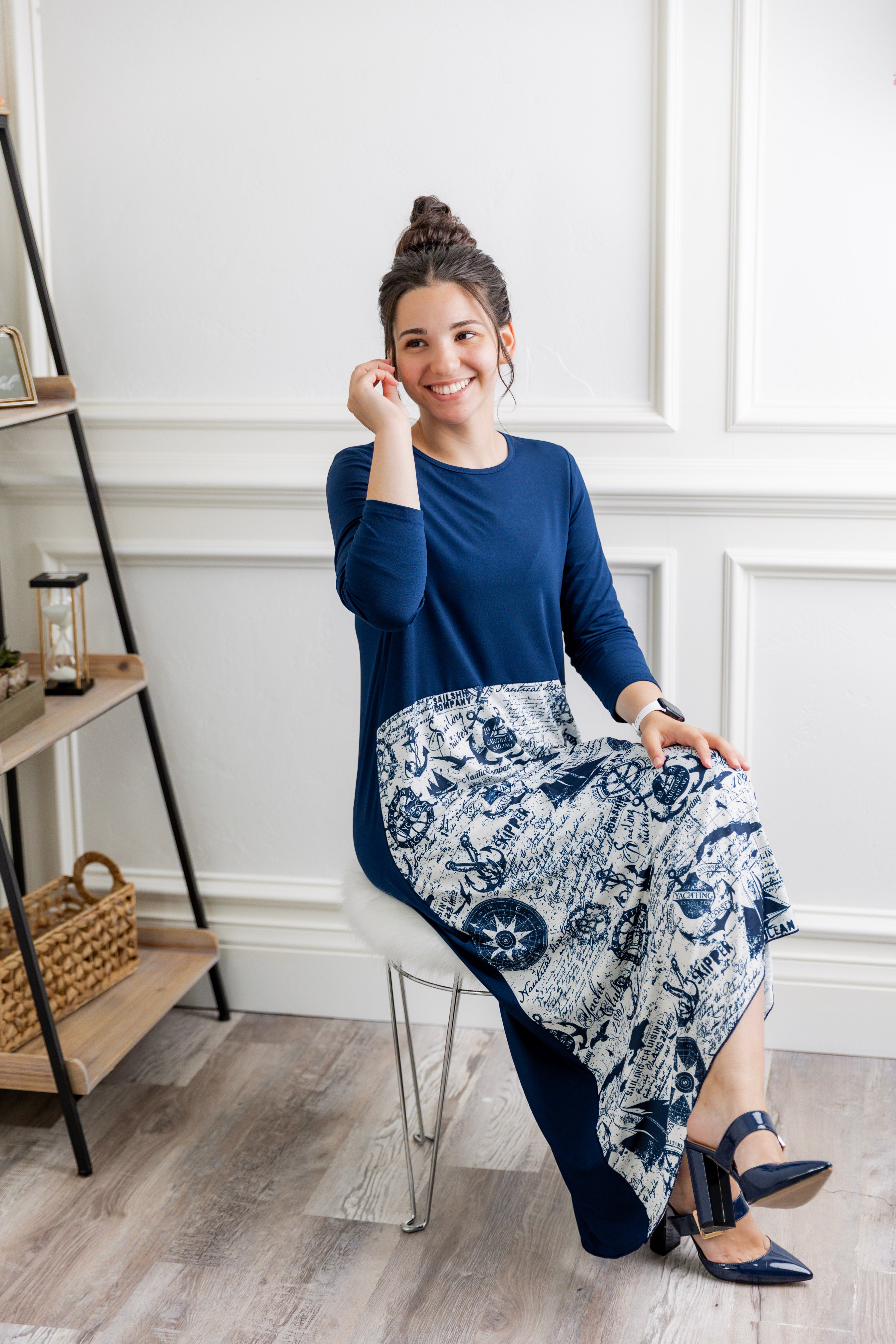 Model modeling Nuggles® Charay Dress with ¾ sleeves and high-low hem. Modest and stylish A-line dress with flattering fit.