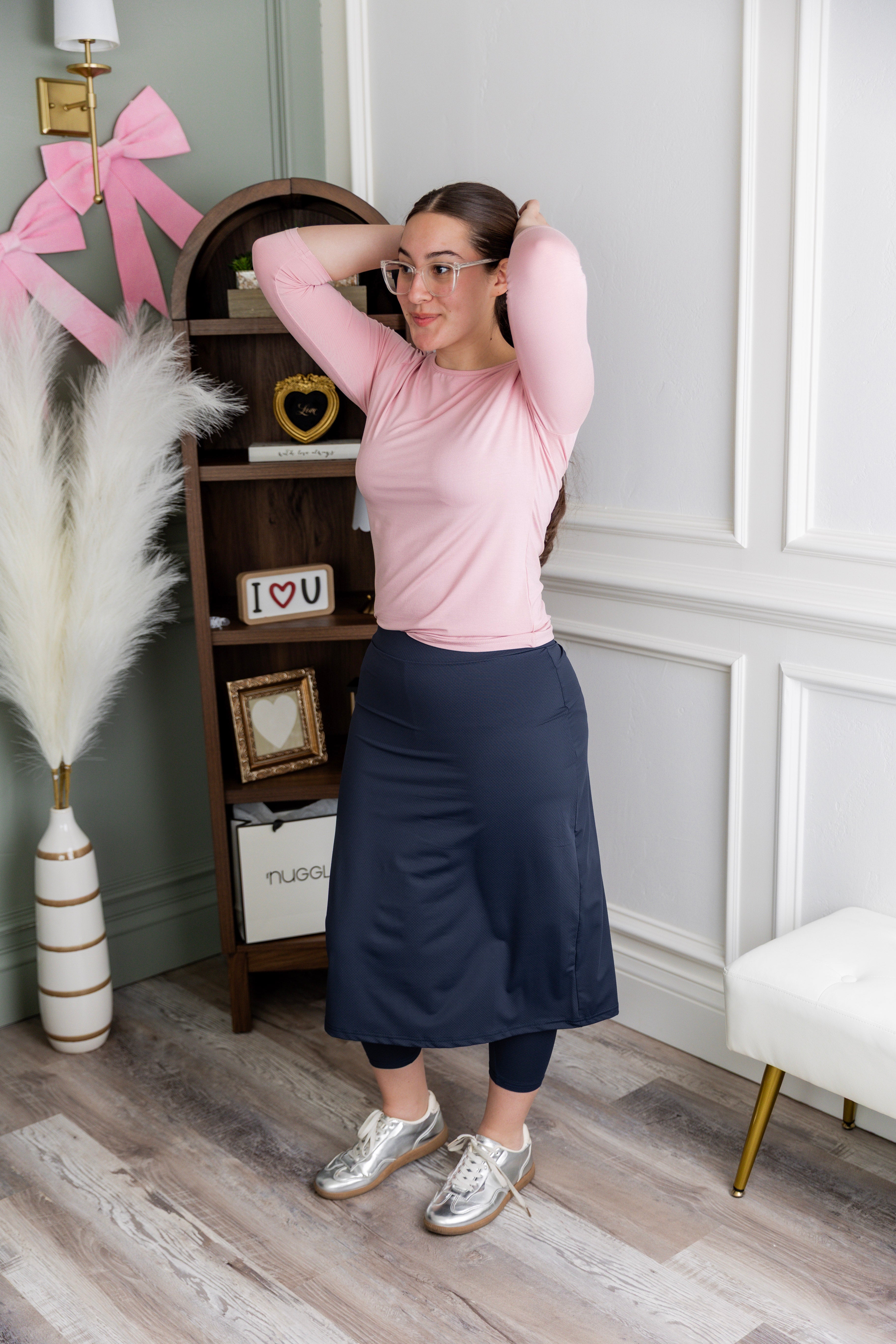 Model wearing Nuggles® 27" All-Sport Skirt in Navy