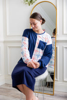 Model wearing the Nuggles® Harlow Top with red and navy color block design.