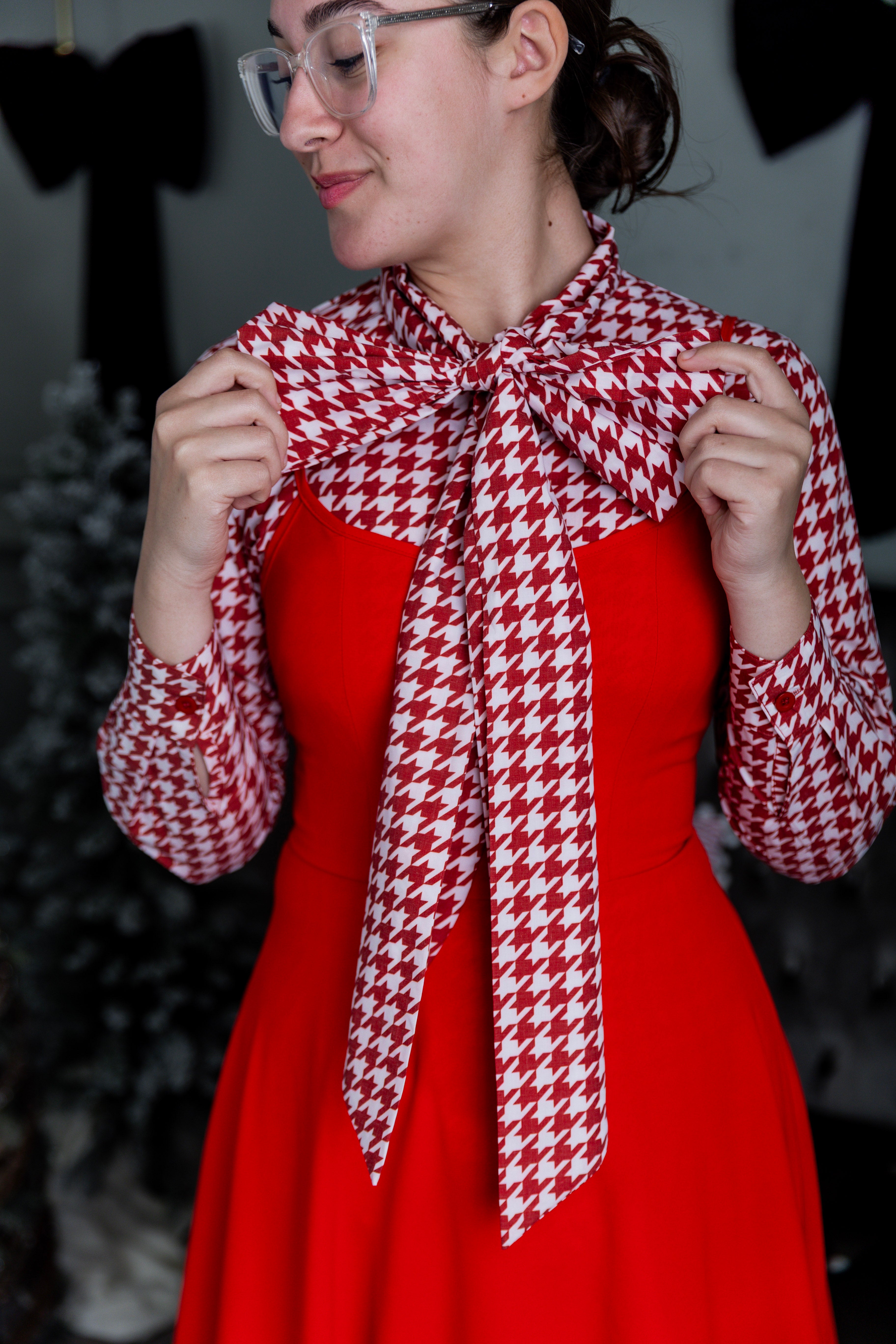 Model wearing Nuggles® Felicity top with large bow tie neckline, modest women's blouse.