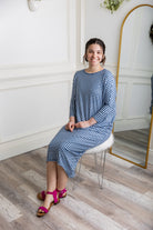 Modest dolman sleeve dress for women with relaxed fit and tapered hem, made from soft stretch knit fabric – perfect for everyday wear.