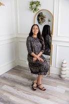 Model wearing our Nuggles® modest Bristol midi dress with 3/4 sleeves and elastic ruffle hem in various prints.