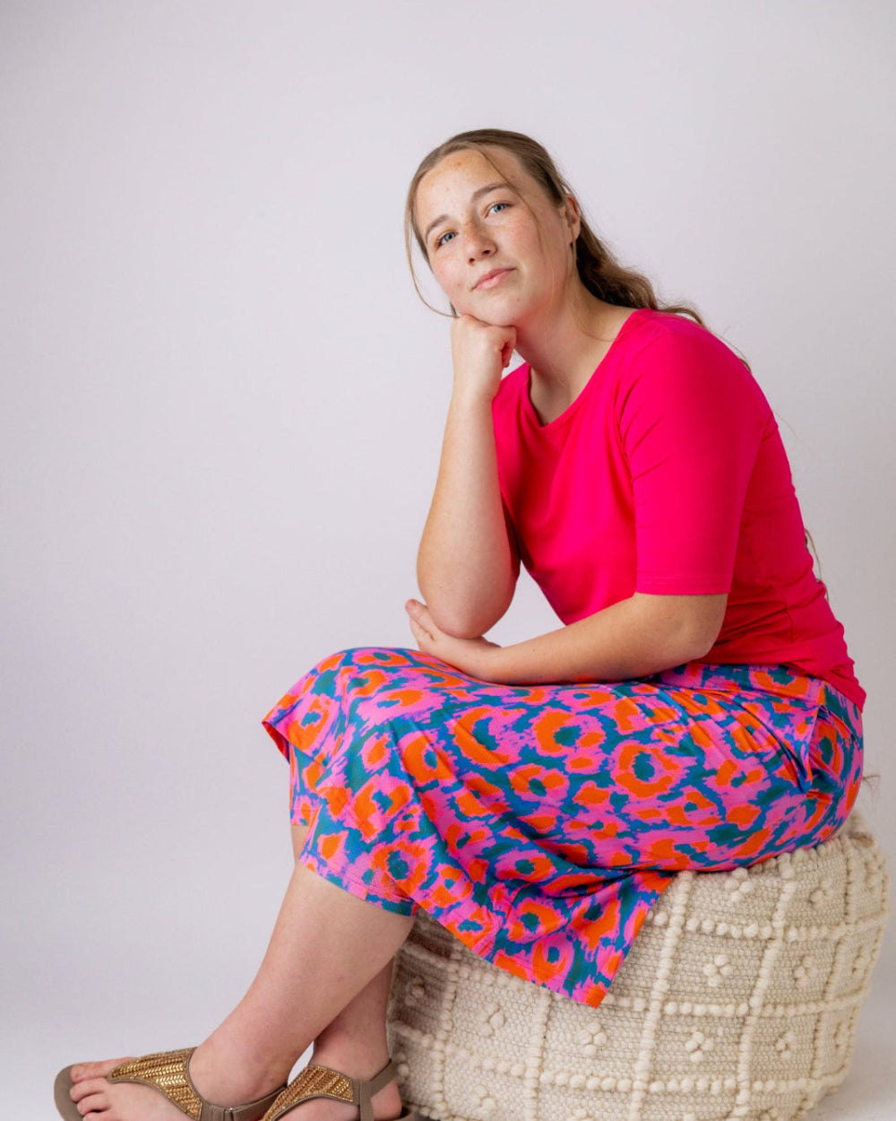 Model wearing the Nuggles® Essential Half Sleeve Tee in Hot Pink