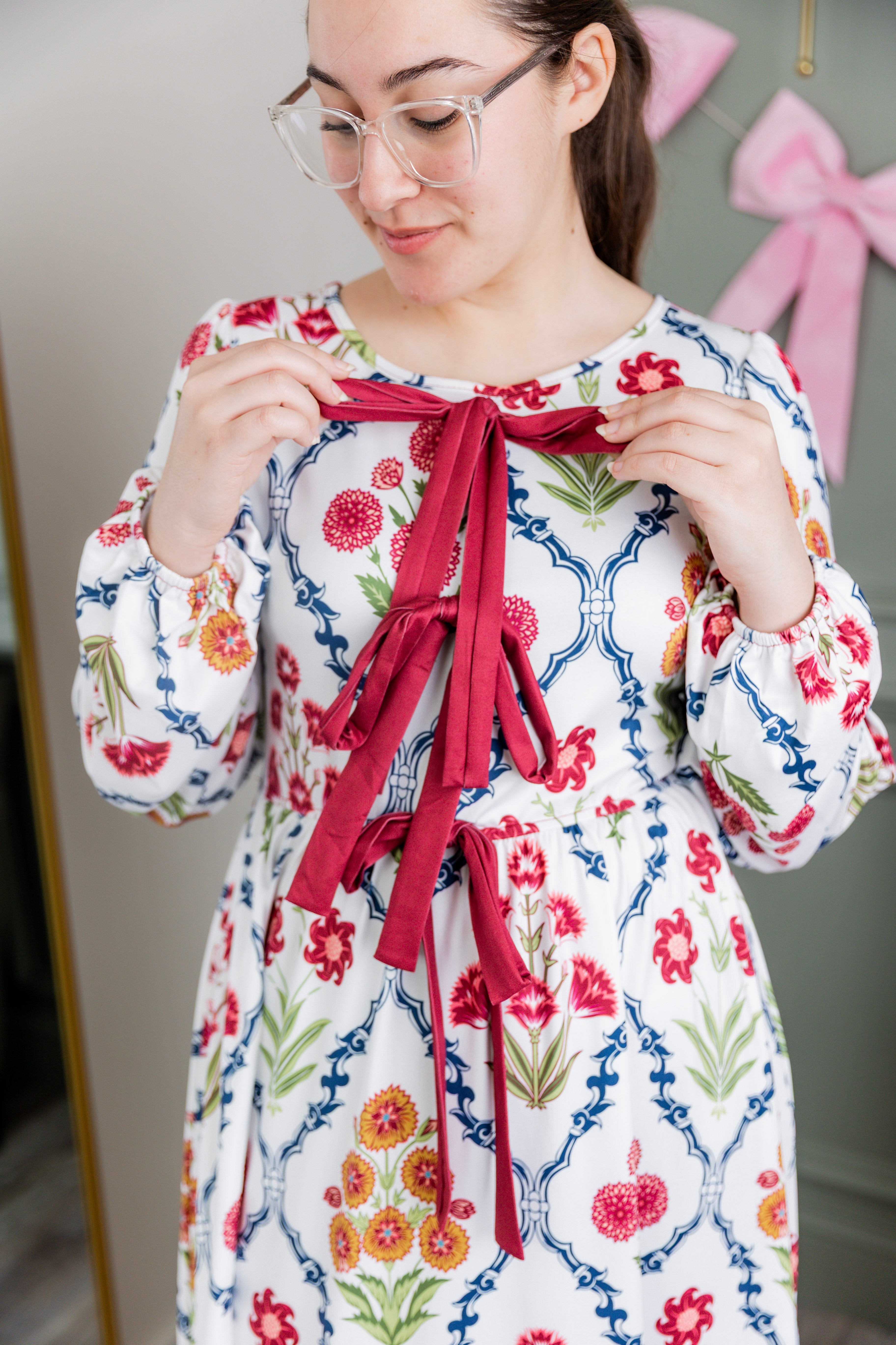 Model wearing the Nuggles® Addison Dress in Wildflower Trellis