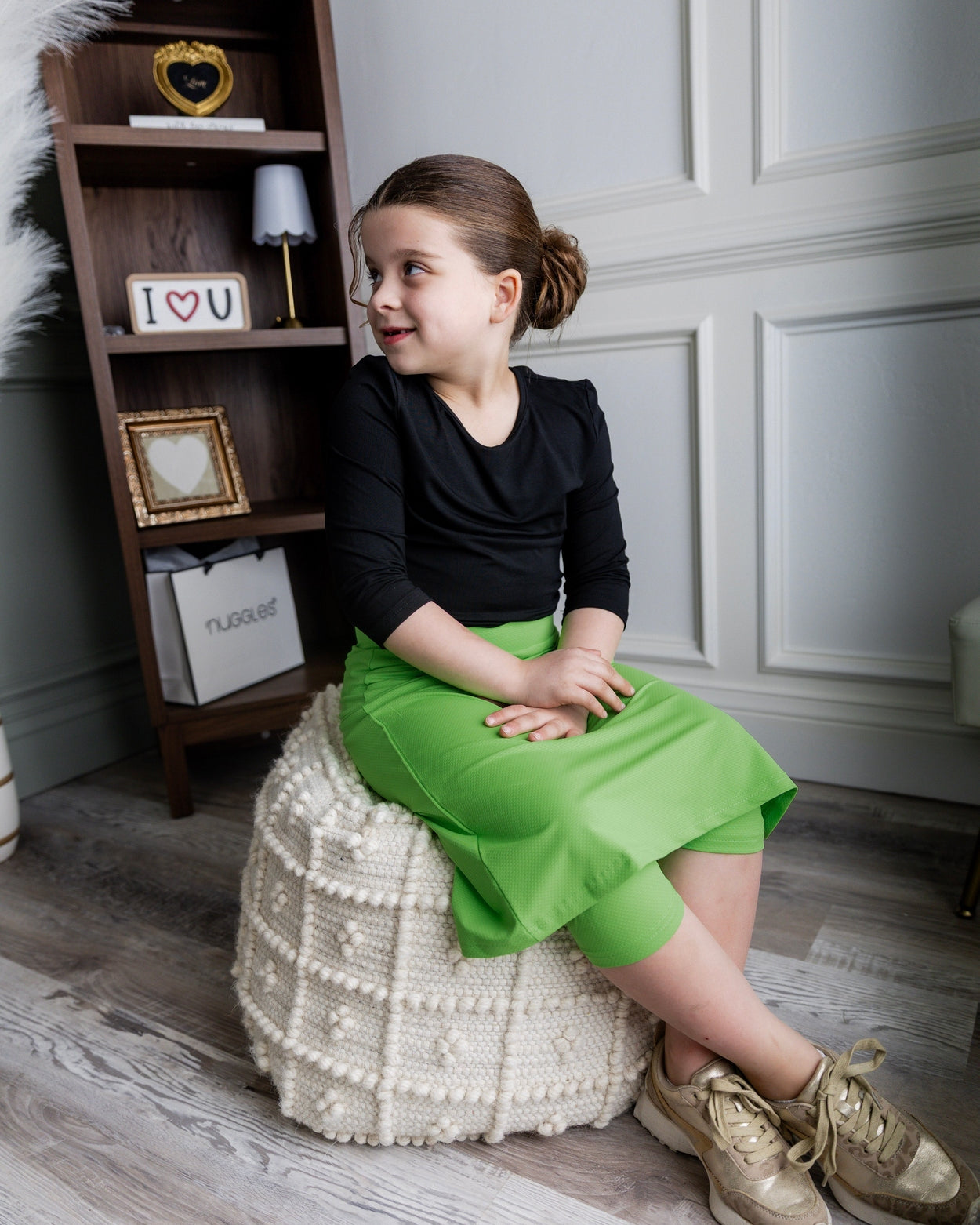 Model wearing Nuggles® Girls' All-Sport Skirt in Green