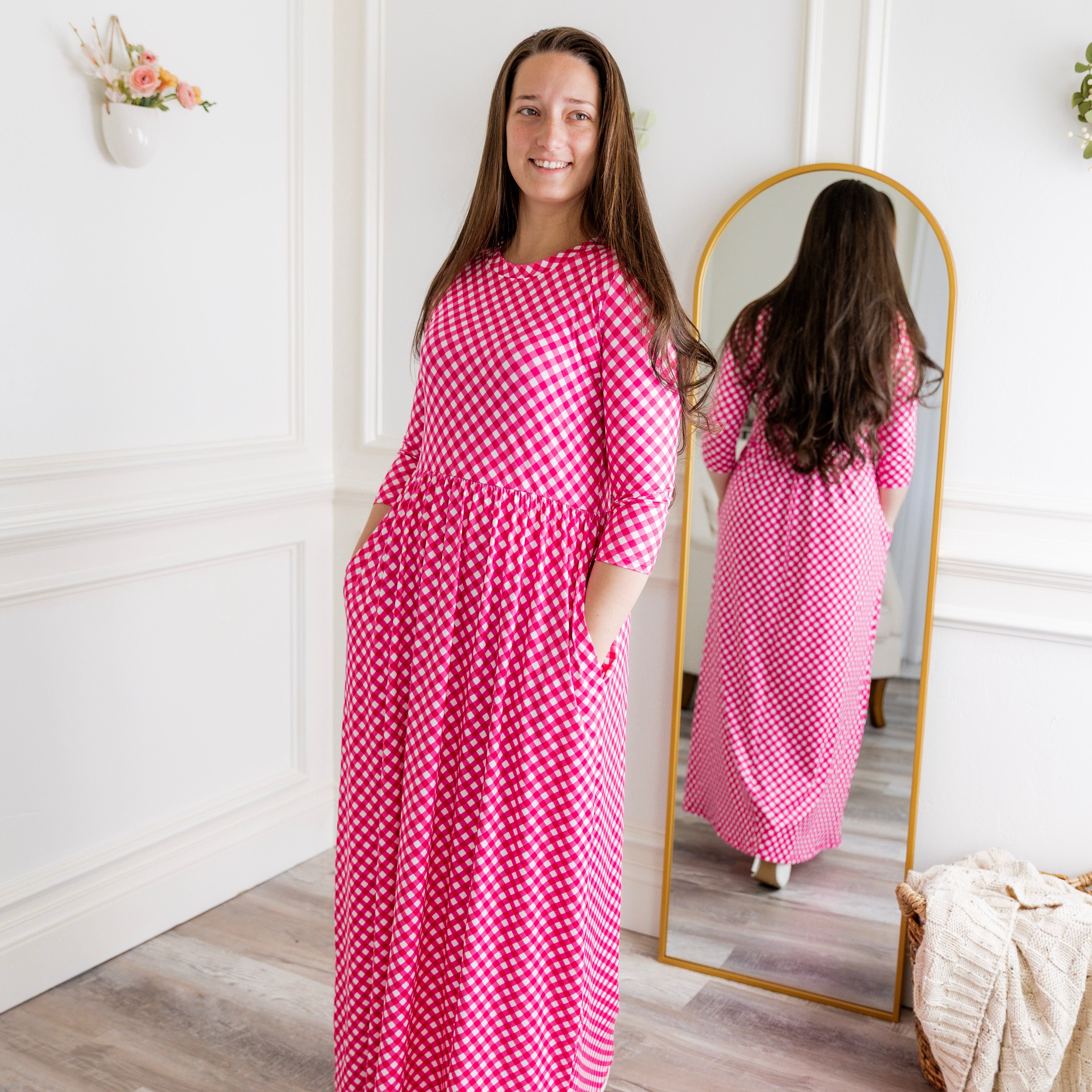 Nuggles® Cleo modest maxi dress in various prints shown with hidden pockets and fitted bodice.