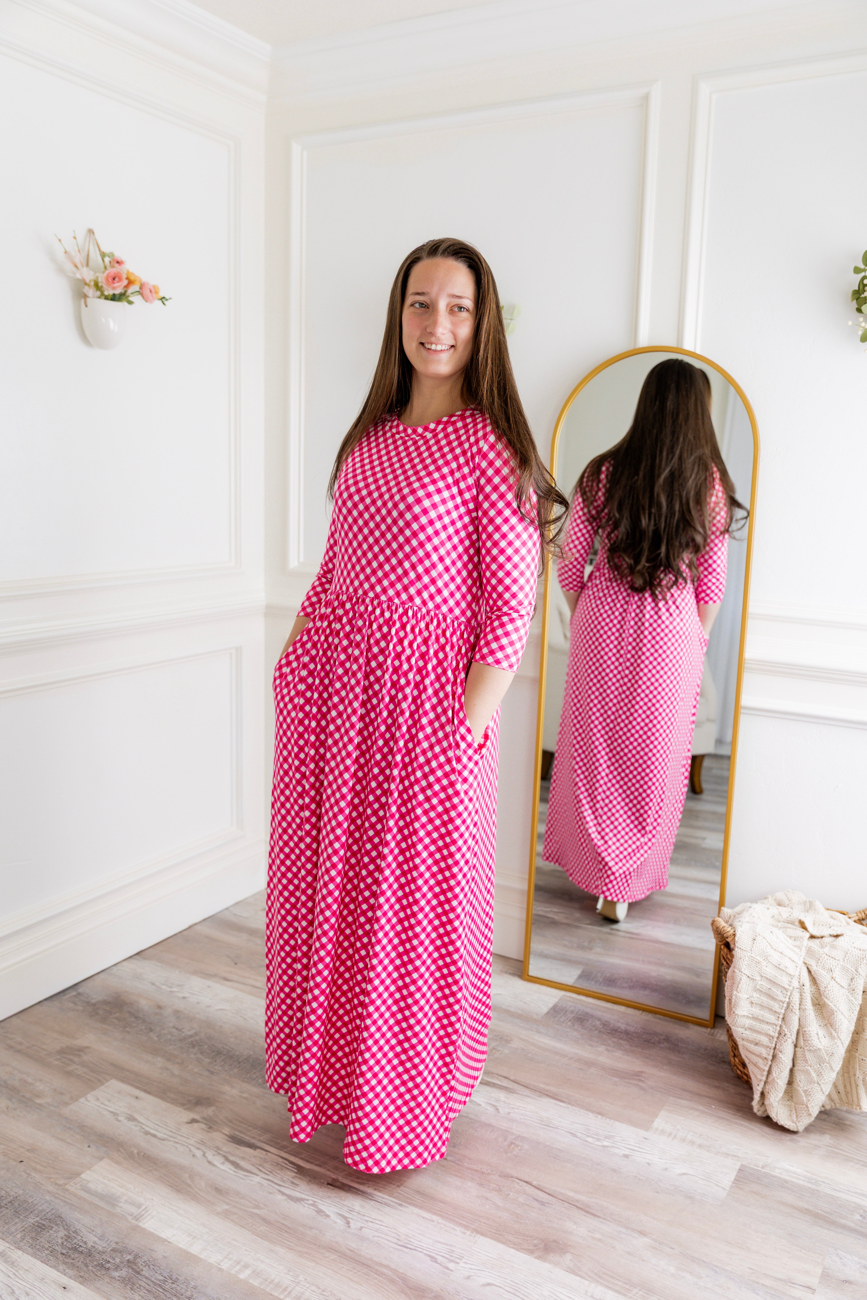 Nuggles® Cleo modest maxi dress in various prints shown with hidden pockets and fitted bodice.