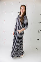 Nuggles® Cleo modest maxi dress in various prints shown with hidden pockets and fitted bodice.