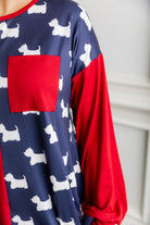 Model wearing the Nuggles® Harlow Top with red and navy color block design.