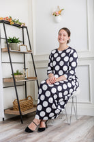 Model wearing Emma Bubble Dress in pretty prints, showcasing full bubble skirt and modest fit.