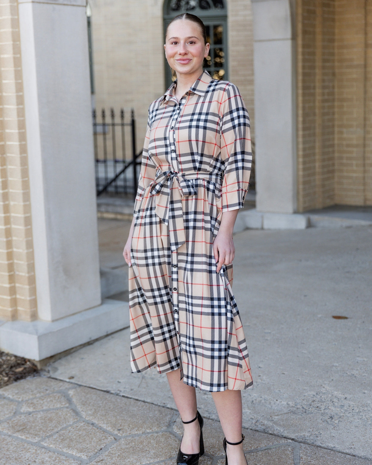 Model wearing the Nuggles® Rachel Dress in Sand Plaid