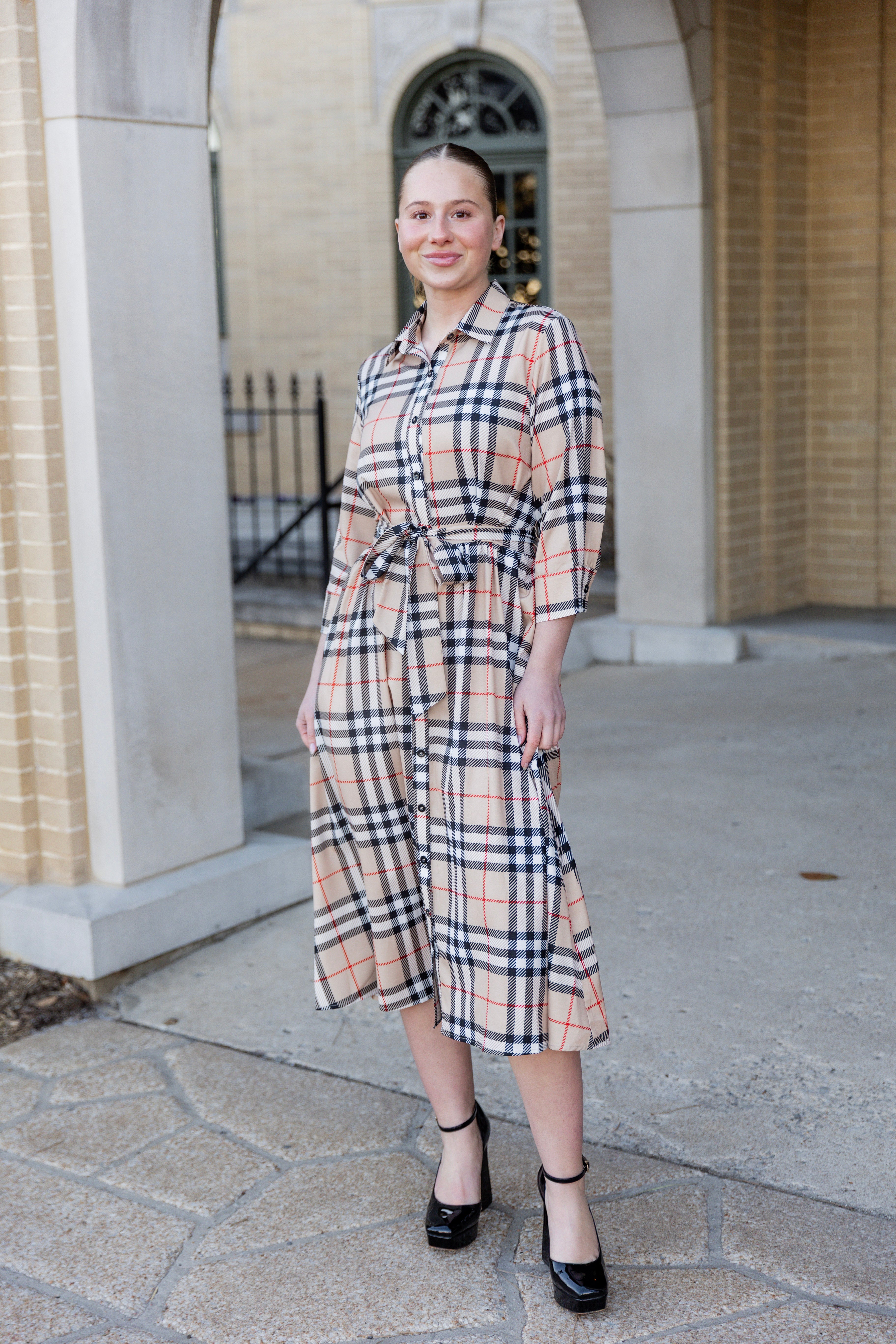 Model wearing the Nuggles® Rachel Dress in Sand Plaid