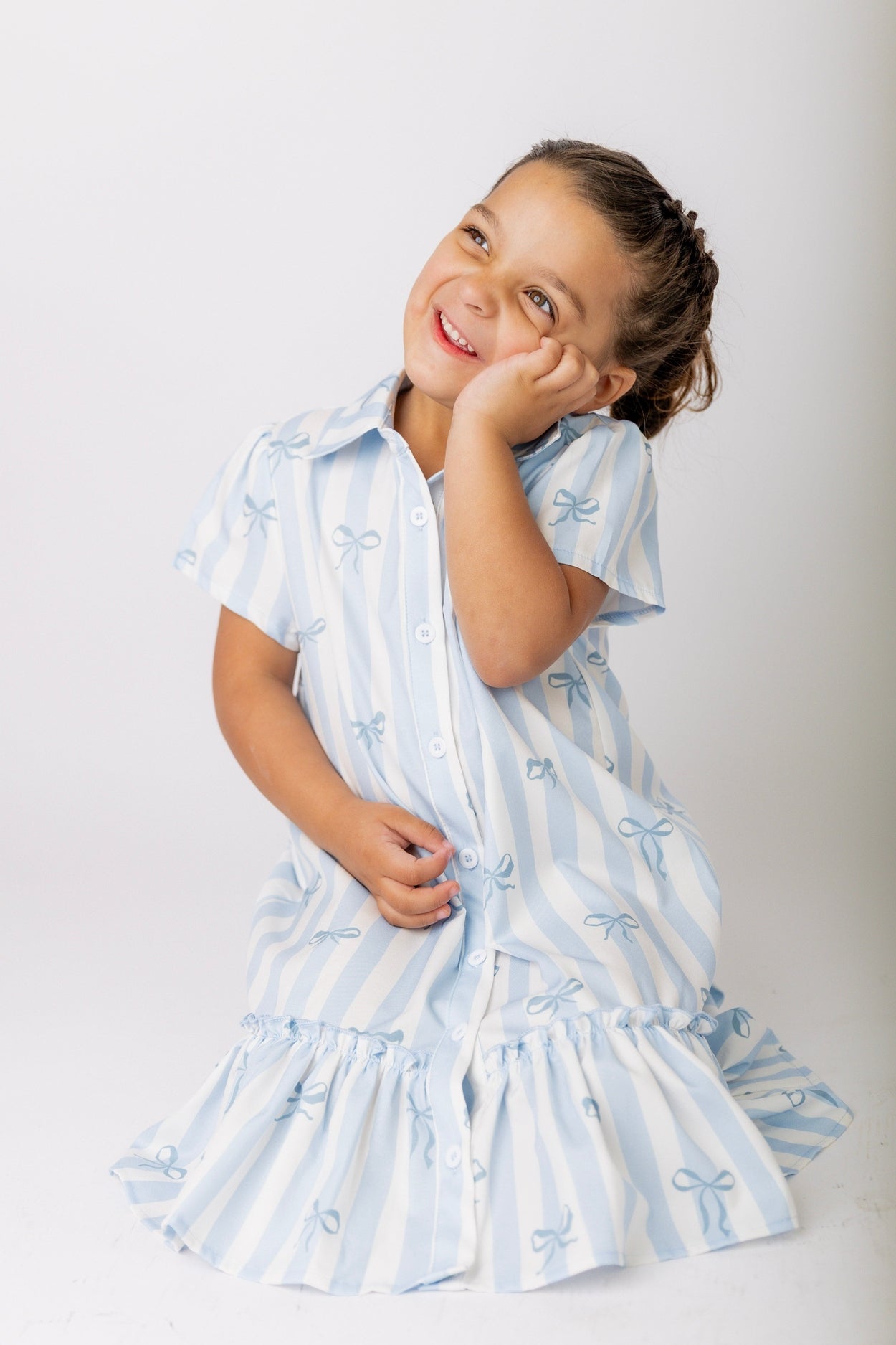 Model wearing Nuggles® Girls' Ellie Dress Dress in Sweet Ribbon Stripe