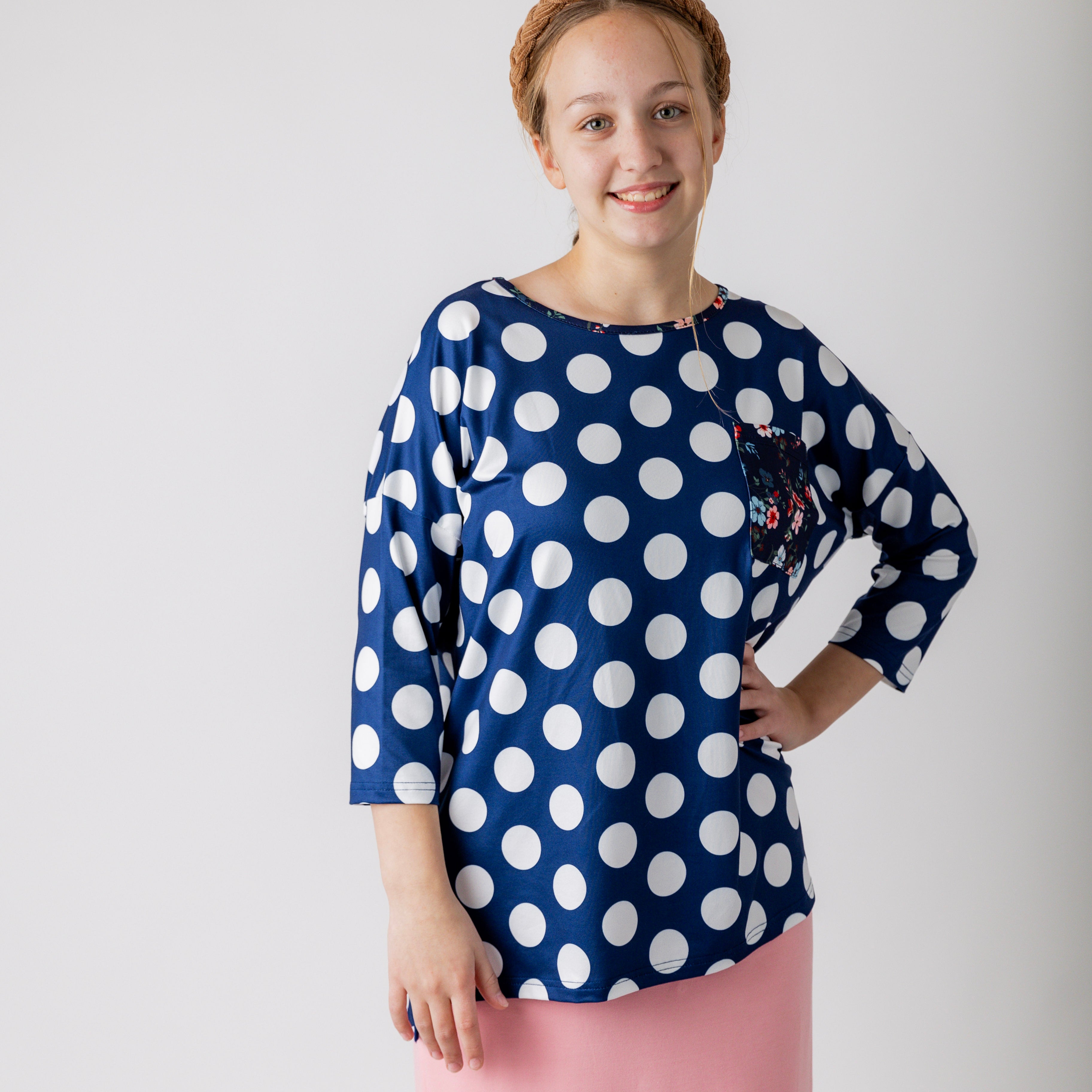 Modest women's Paisley Top with 3/4 sleeves, front pocket, and contrast knit fabrics, styled with a classic skirt – perfect for everyday wear or church outfits