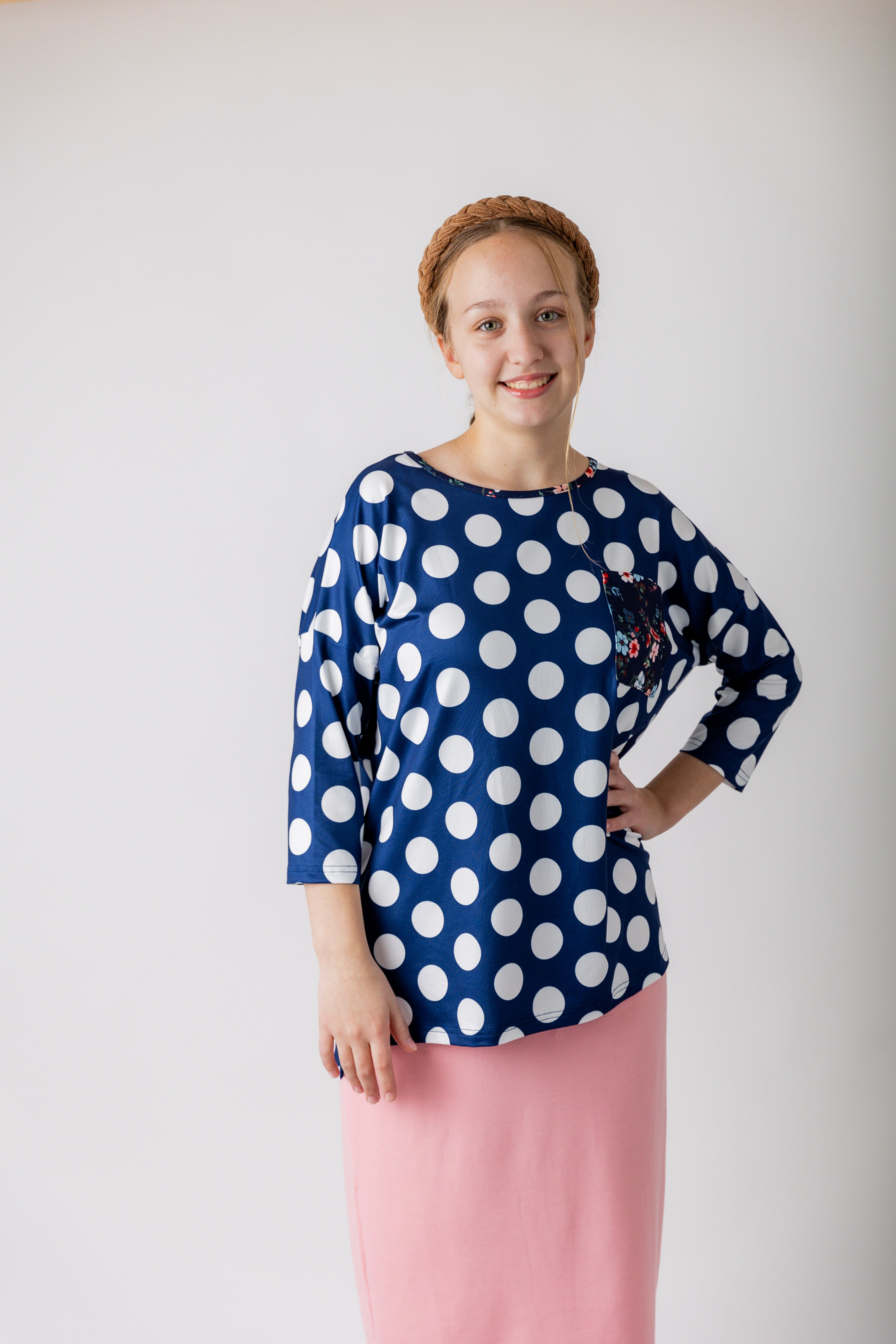 Modest women's Paisley Top with 3/4 sleeves, front pocket, and contrast knit fabrics, styled with a classic skirt – perfect for everyday wear or church outfits