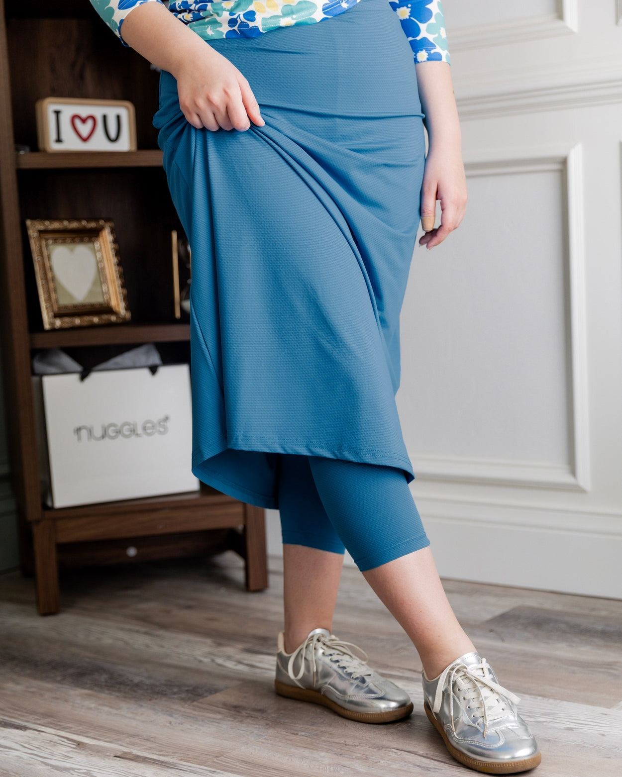 Model wearing Nuggles® 31" All-Sport Skirt in Turquoise