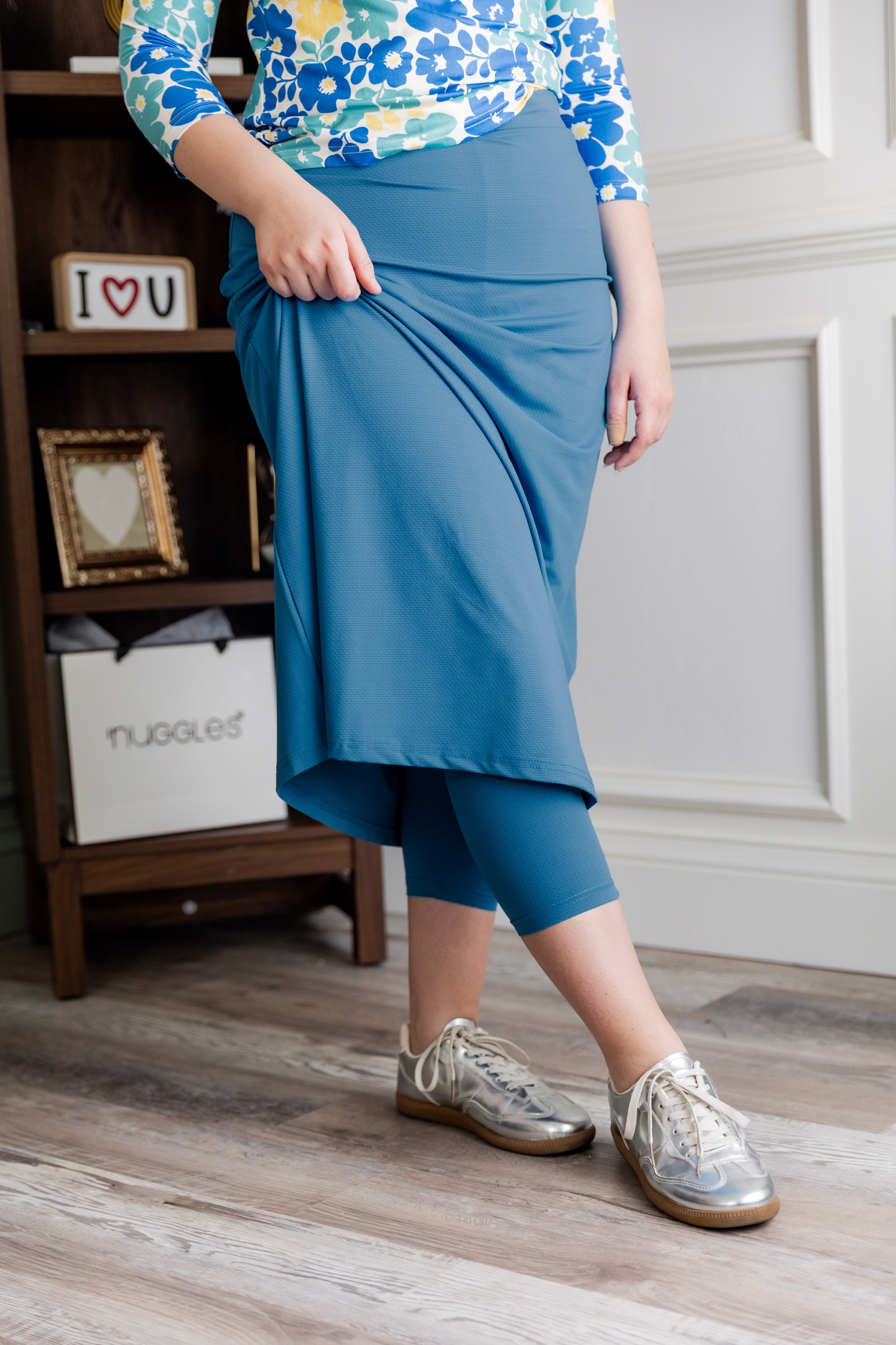 Model wearing Nuggles® 31" All-Sport Skirt in Turquoise