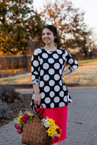 Model wearing the 3/4 Sleeve Victoria Top in floral print, paired with a modest Classic skirt. Modest women’s fashion with 3/4 sleeves and hip-length fit, perfect for church, work, or everyday wear.
