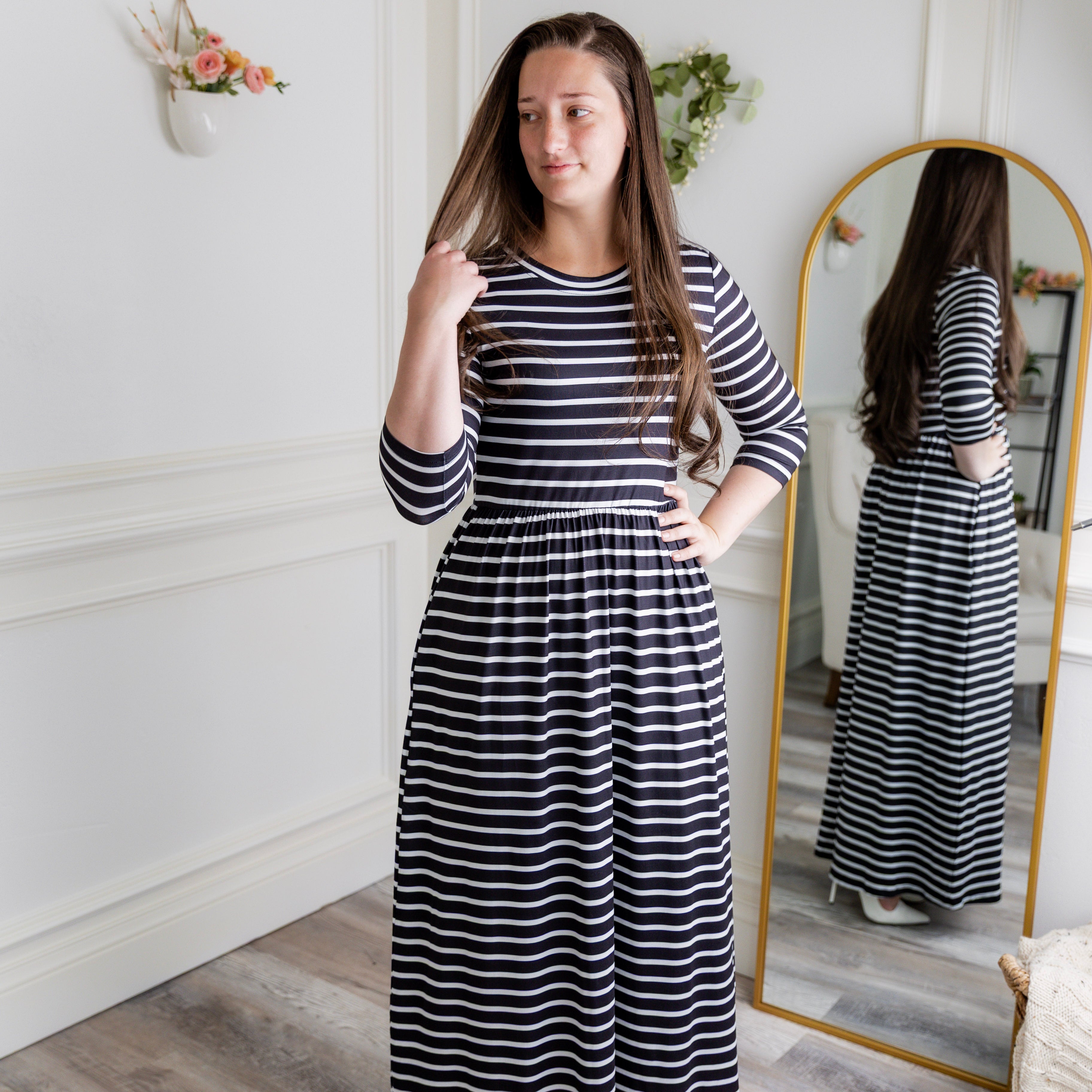 Nuggles® Cleo modest maxi dress in various prints shown with hidden pockets and fitted bodice.