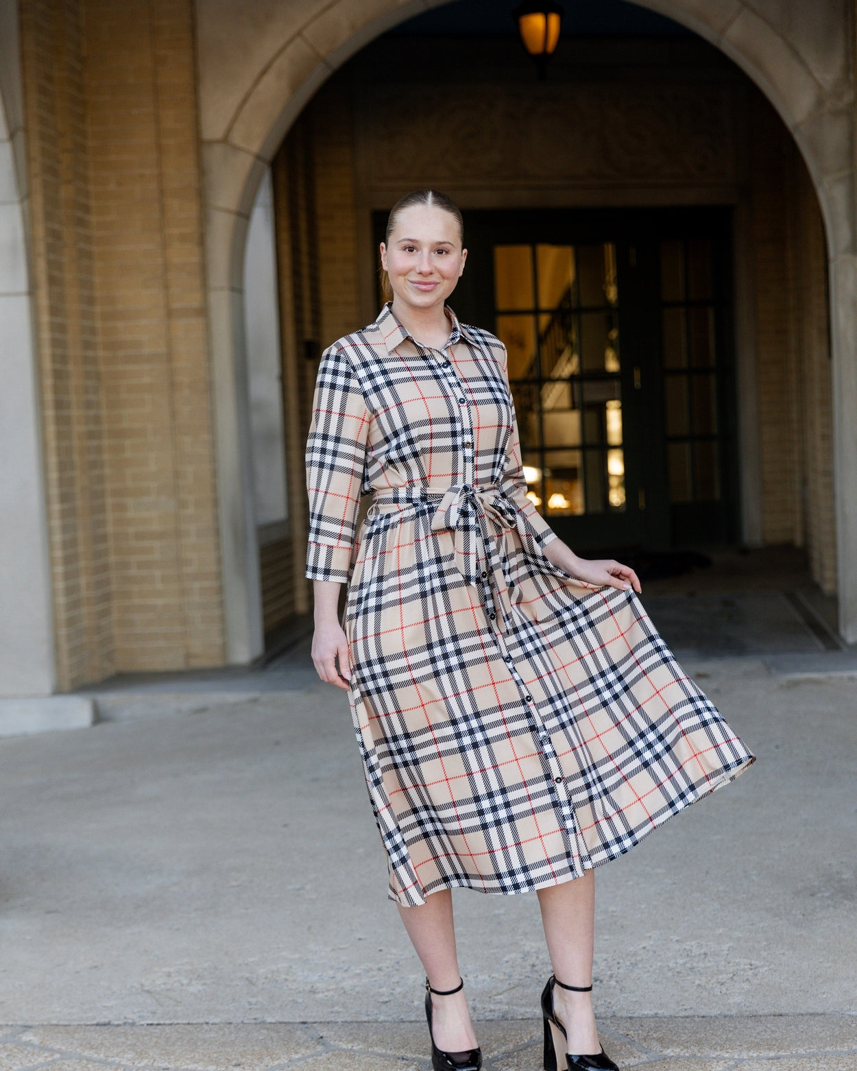 Model wearing the Nuggles® Rachel Dress in Sand Plaid