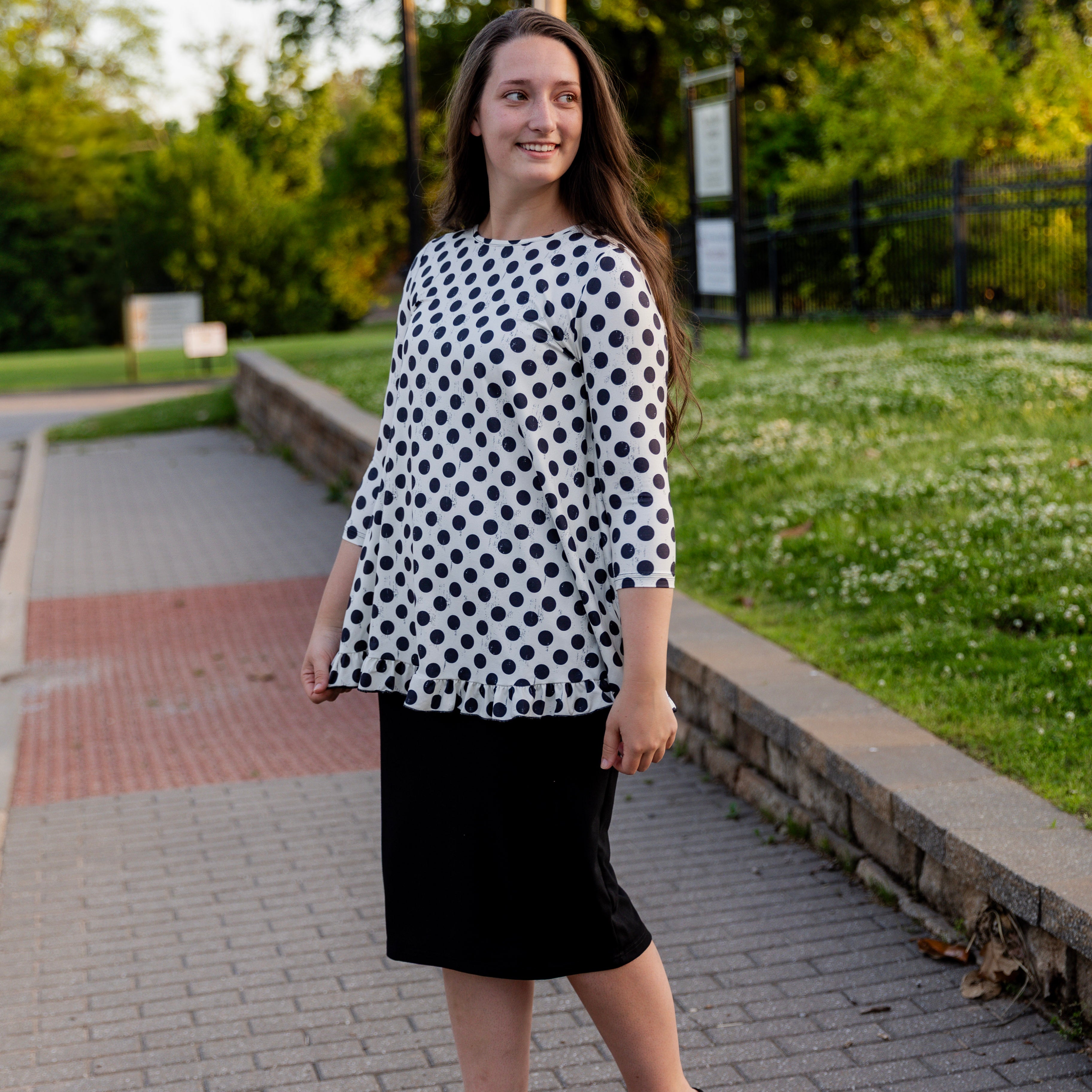 Model wearing the Avery Top, featuring modest 3/4 sleeves and a flowy, flattering fit.