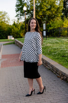 Model wearing the Avery Top, featuring modest 3/4 sleeves and a flowy, flattering fit.