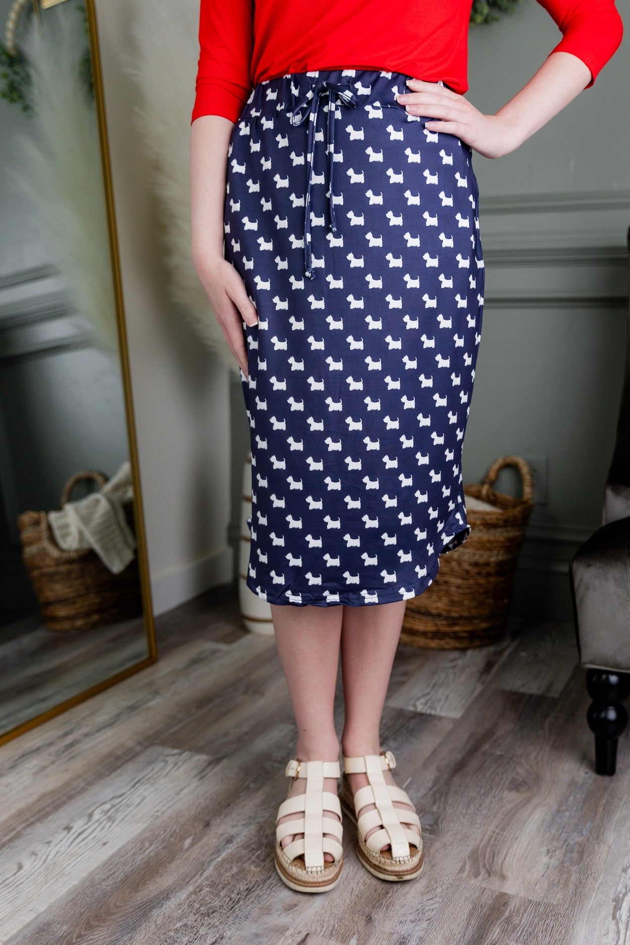 Model wearing Modest Nuggles® 27" Drawstring Skirt in Doggy Doodles