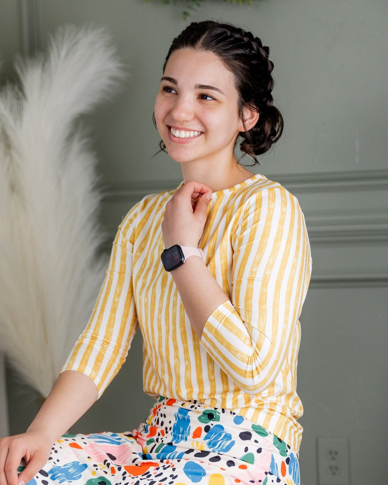 Model wearing Nuggles® 27" Sport Skirt in Party Sprinkles and 3/4 Essential Tee in Lemon Drop Stripe