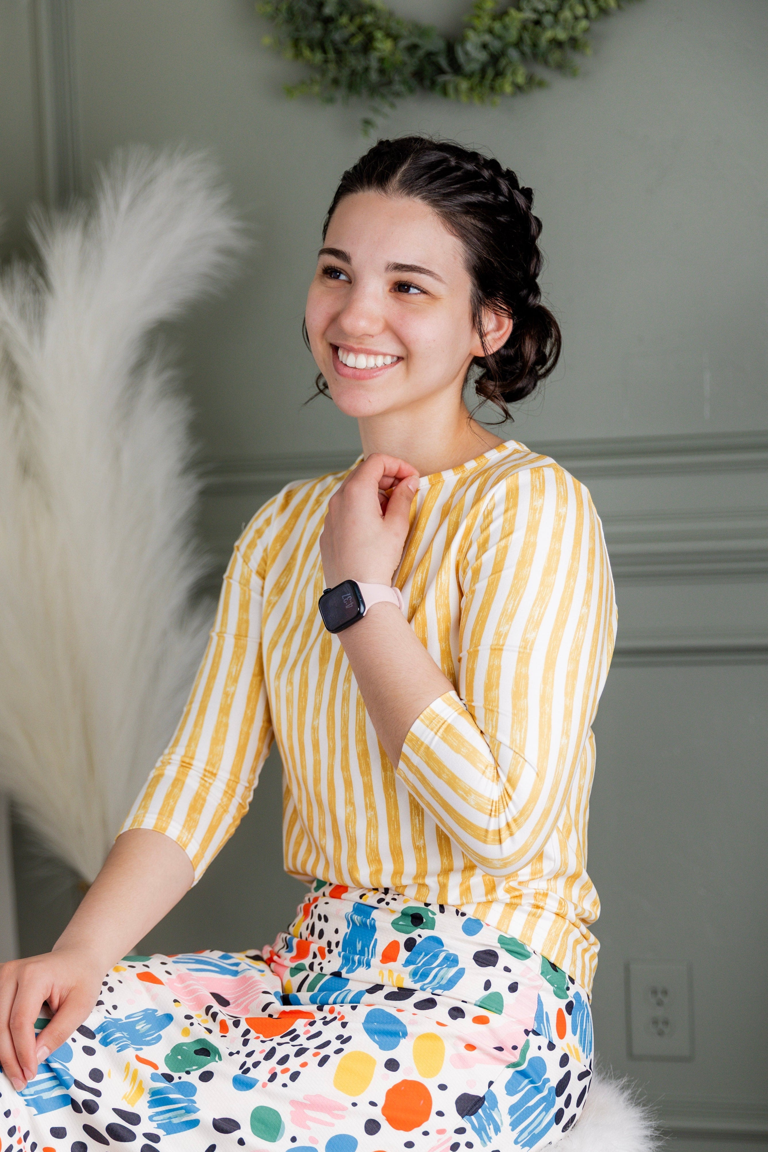 Model wearing Nuggles® 27" Sport Skirt in Party Sprinkles and 3/4 Essential Tee in Lemon Drop Stripe