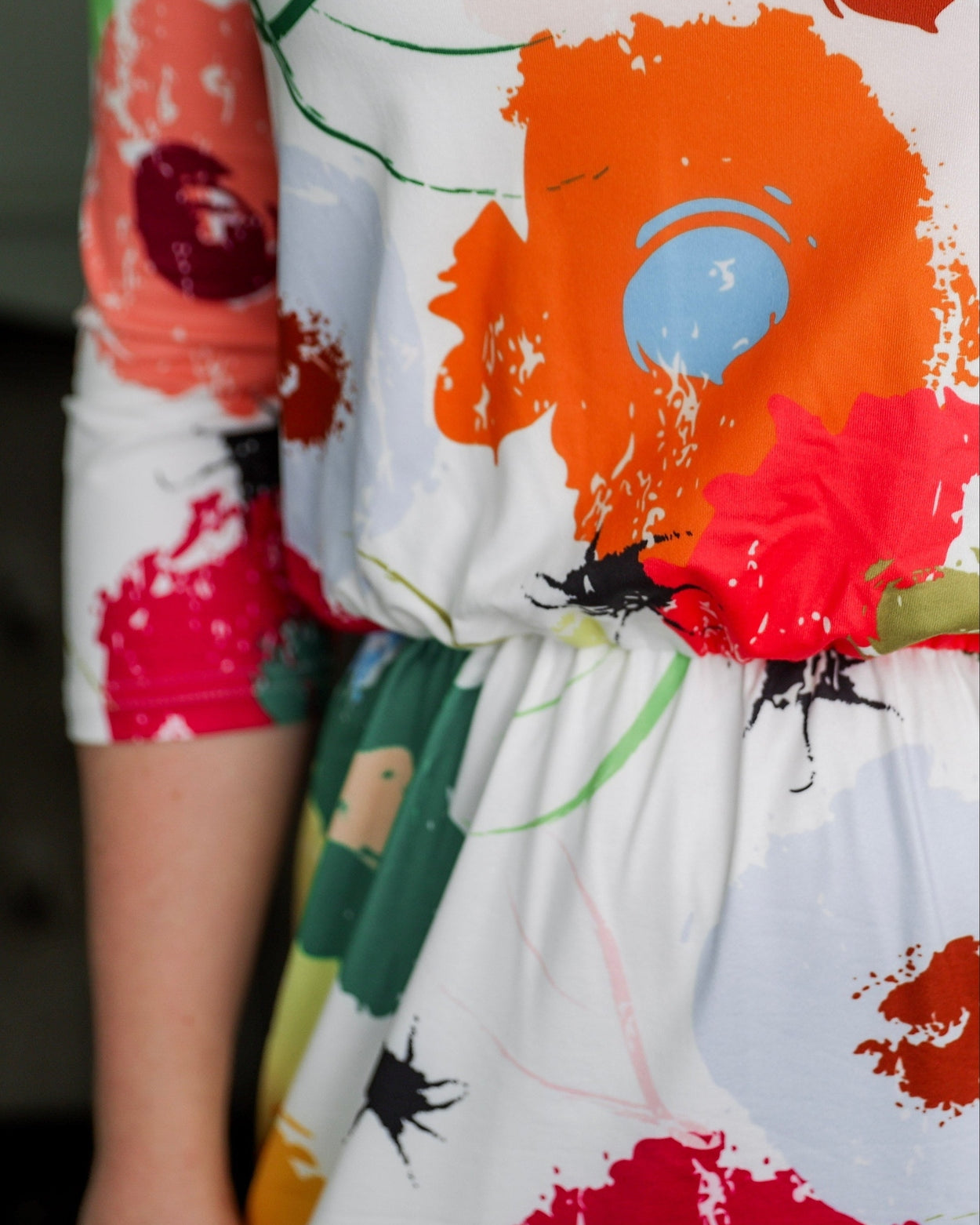 Model wearing Nuggles® Harper Jane Dress in Party Blooms