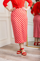 Model showcasing  Nuggles® midi tee skirts in various solid colors, modest 27" and 31" lengths