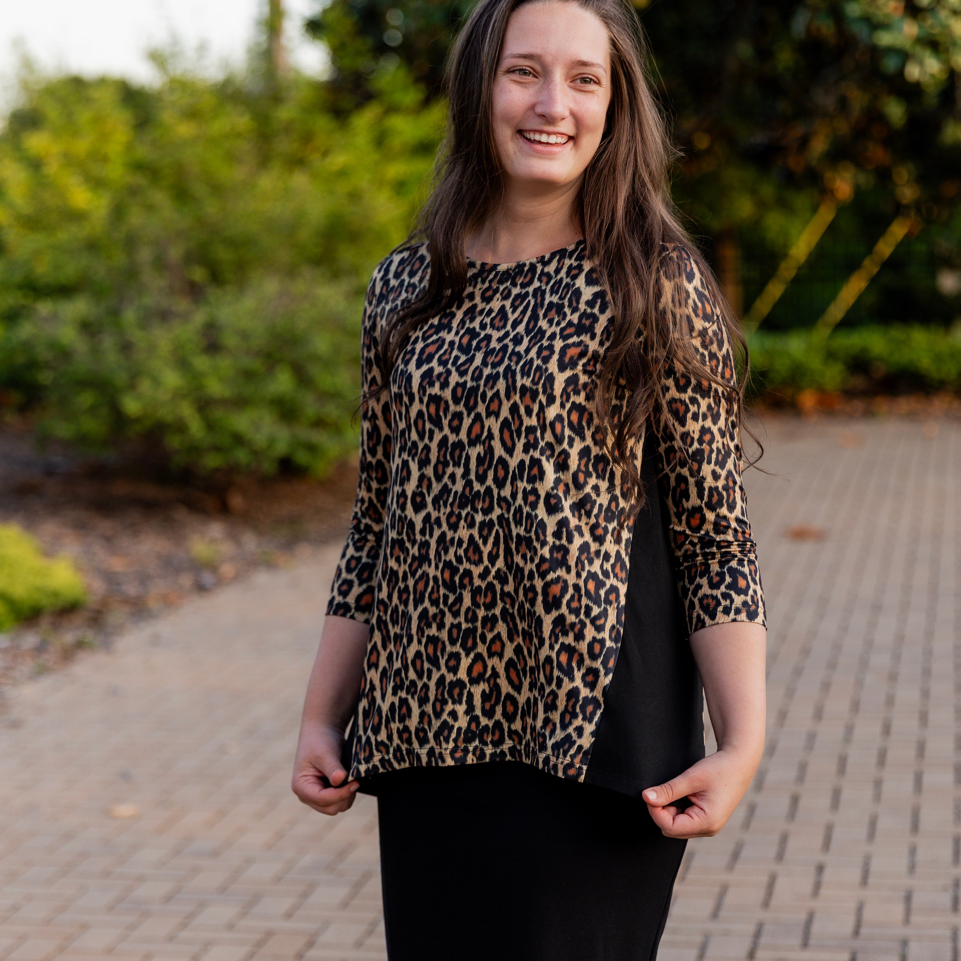 Model wearing the Adrielle Top with 3/4 sleeves and a classic skirt – modest women's top from Nuggles®