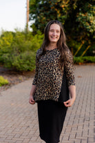 Model wearing the Adrielle Top with 3/4 sleeves and a classic skirt – modest women's top from Nuggles®