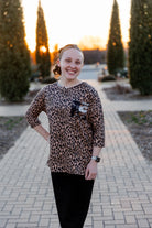 Modest women's Paisley Top with 3/4 sleeves, front pocket, and contrast knit fabrics, styled with a classic skirt – perfect for everyday wear or church outfits