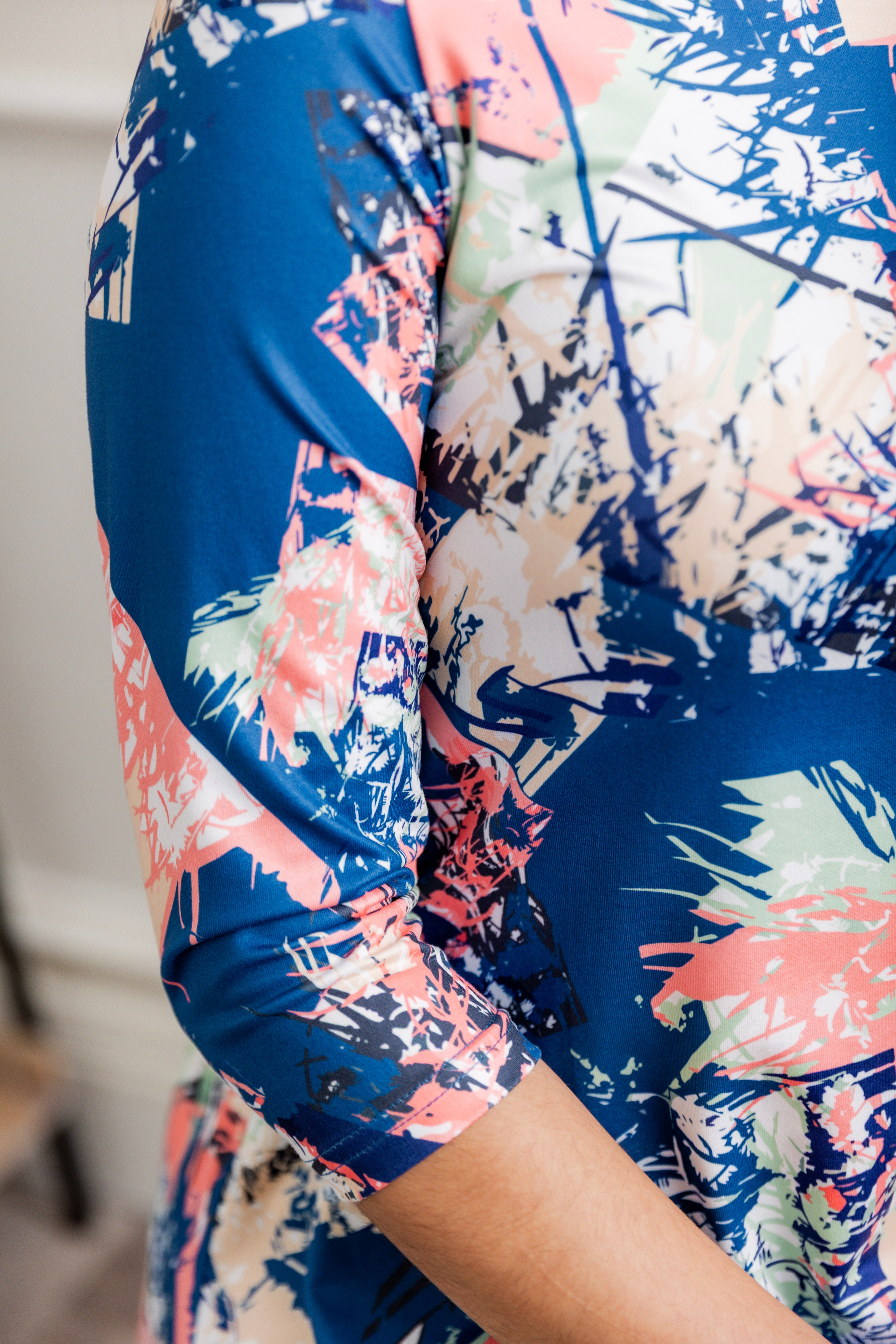 Bright abstract print tunic top for women – Nuggles® Rose Top with blue, pink, and cream splashes, modest and flowy fit.