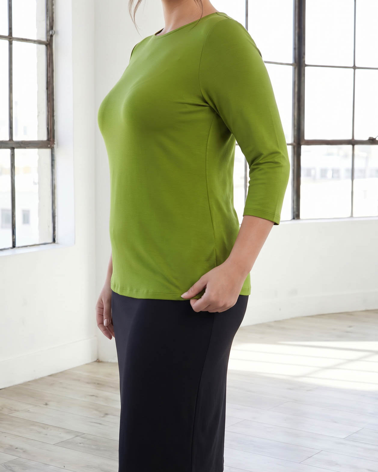 Model wearing Nuggles® 3/4 Essential Tee in Avocado