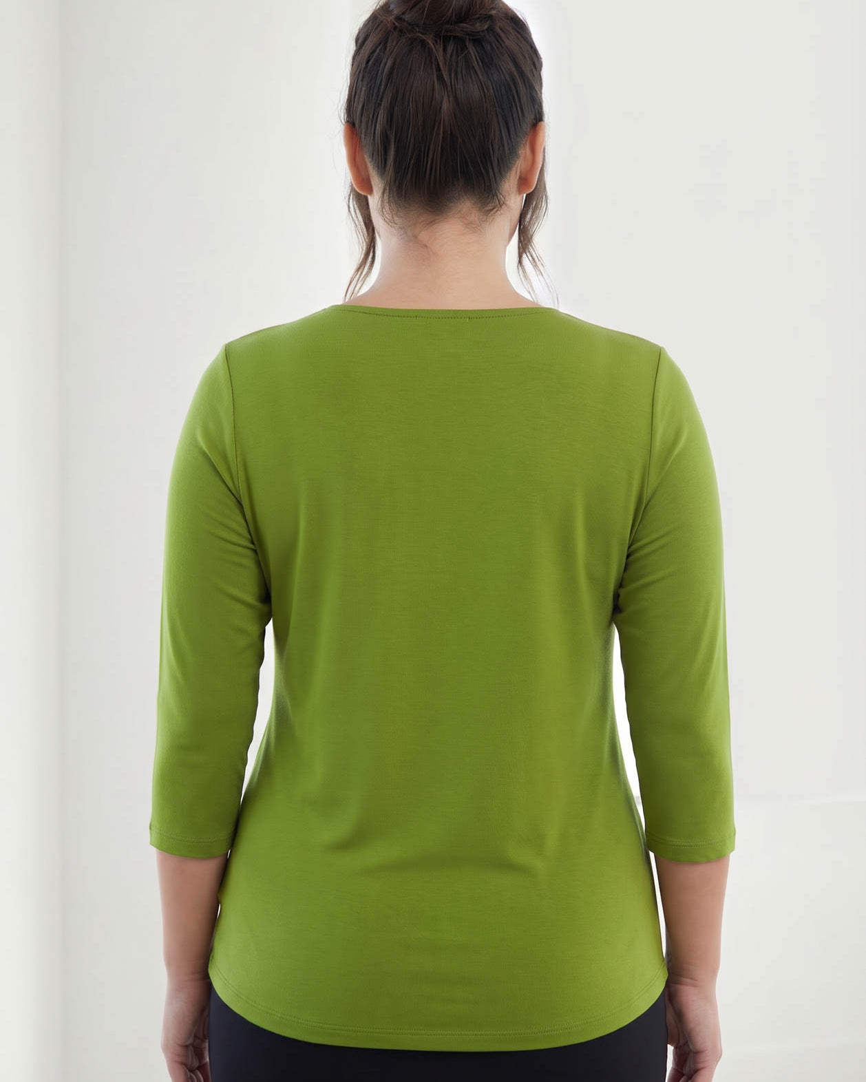 Model wearing Nuggles® 3/4 Essential Tee in Avocado