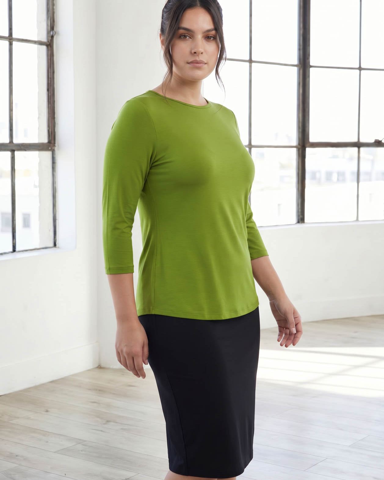 Model wearing Nuggles® 3/4 Essential Tee in Avocado