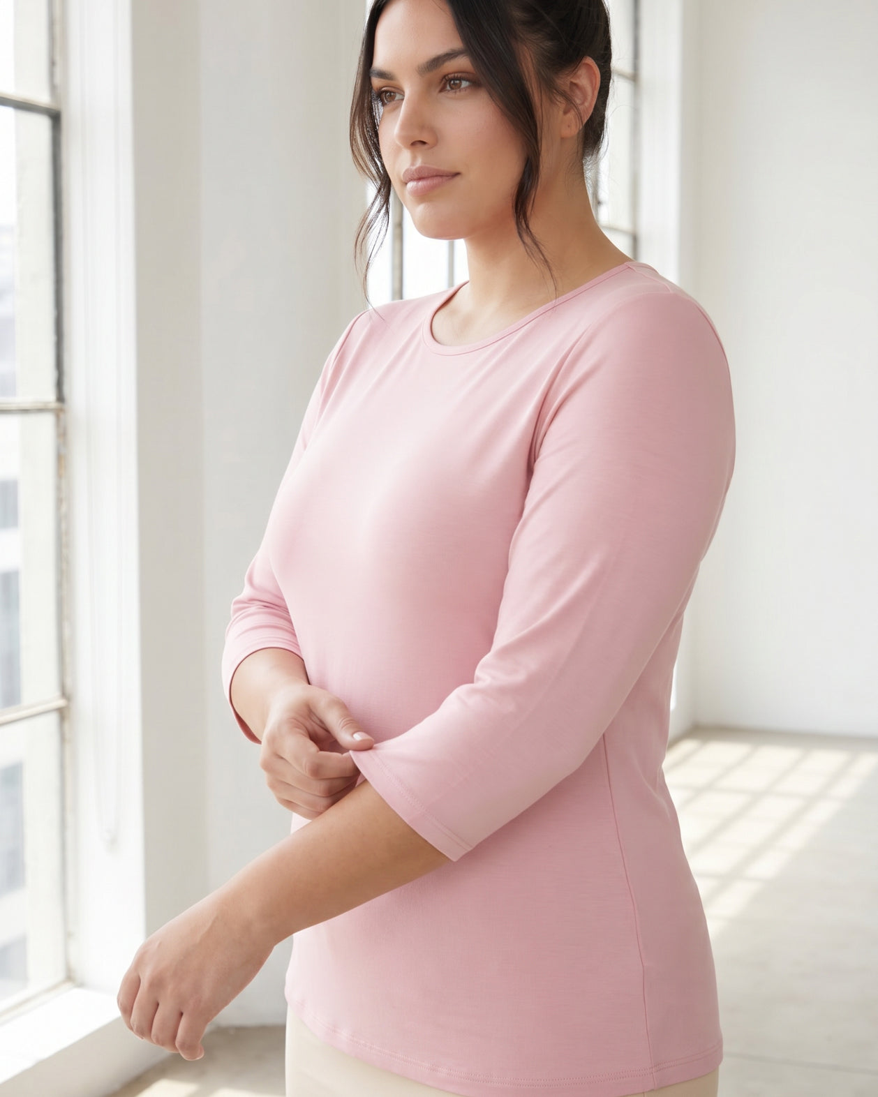 Model wearing Nuggles® 3/4 Essential Tee in Baby Pink