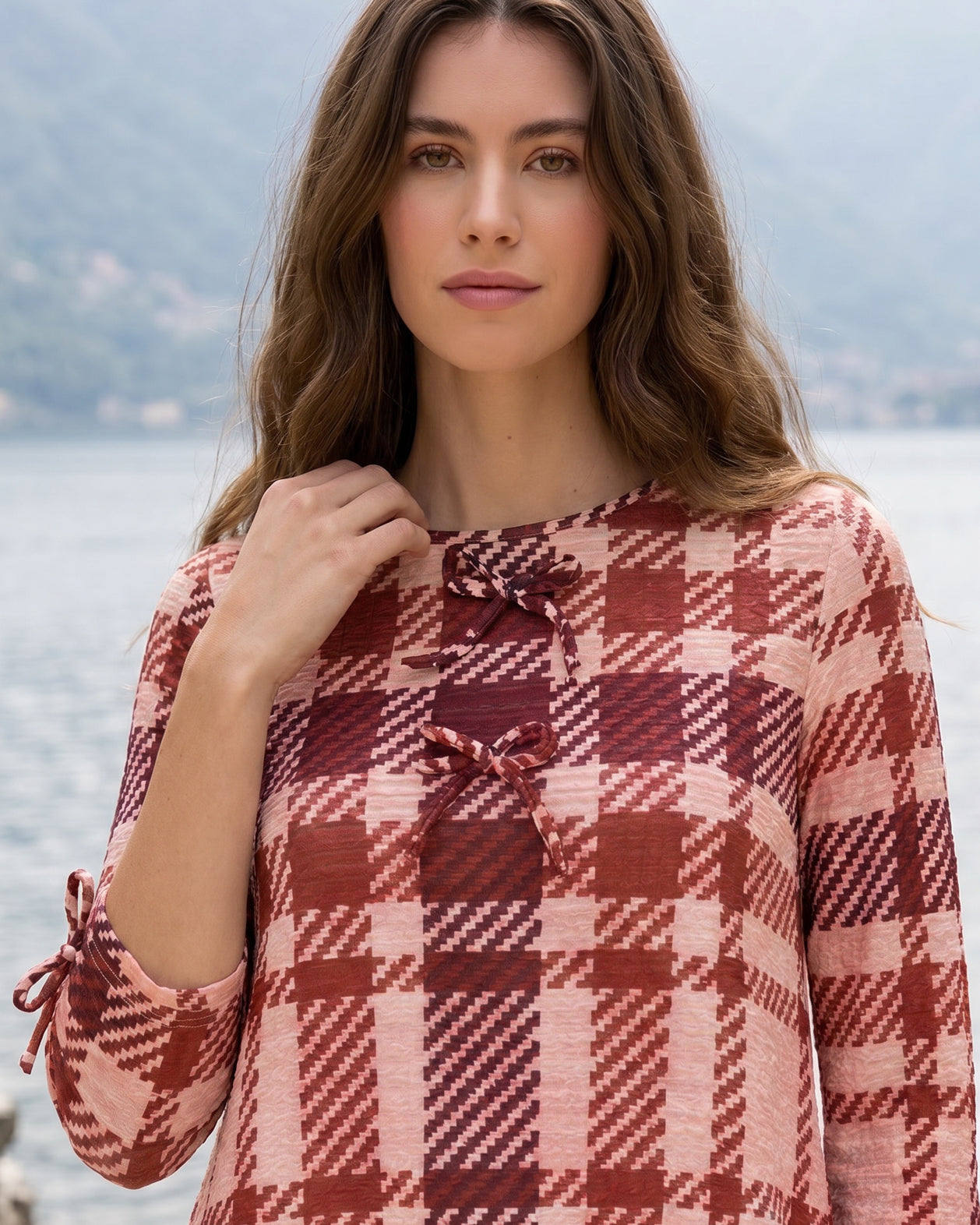 Model wearing Nuggles® Lexi Bow Top in Berry Paid