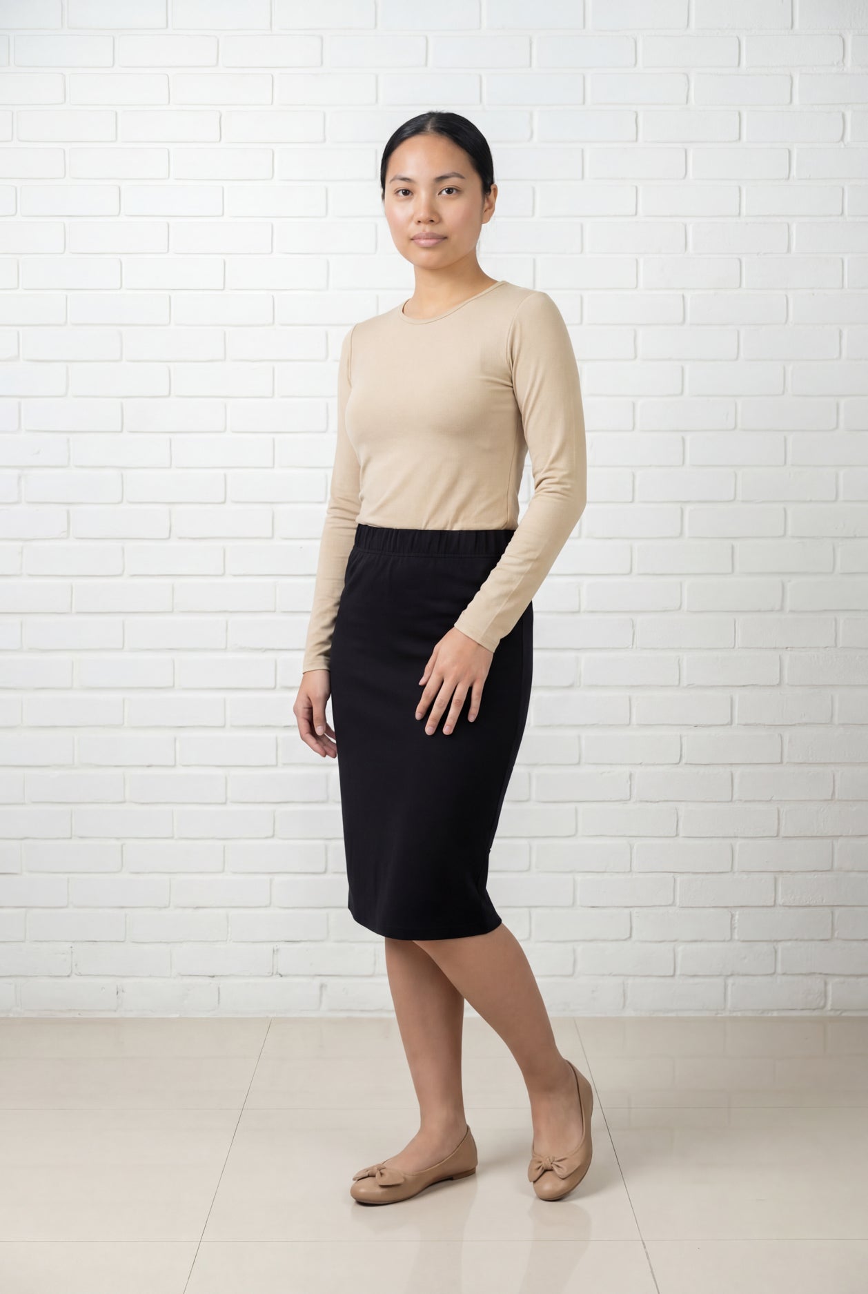 Model wearing Nuggles® 25" Relaxed Midi Skirt in Black