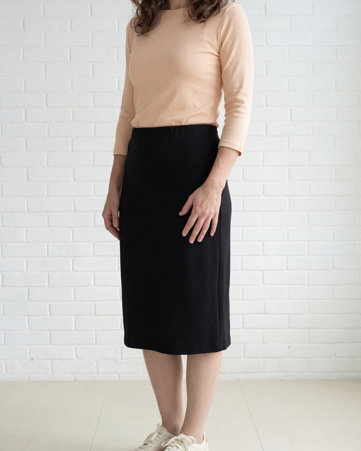 Model wearing Nuggles® 27" Relaxed Midi Skirt in Black
