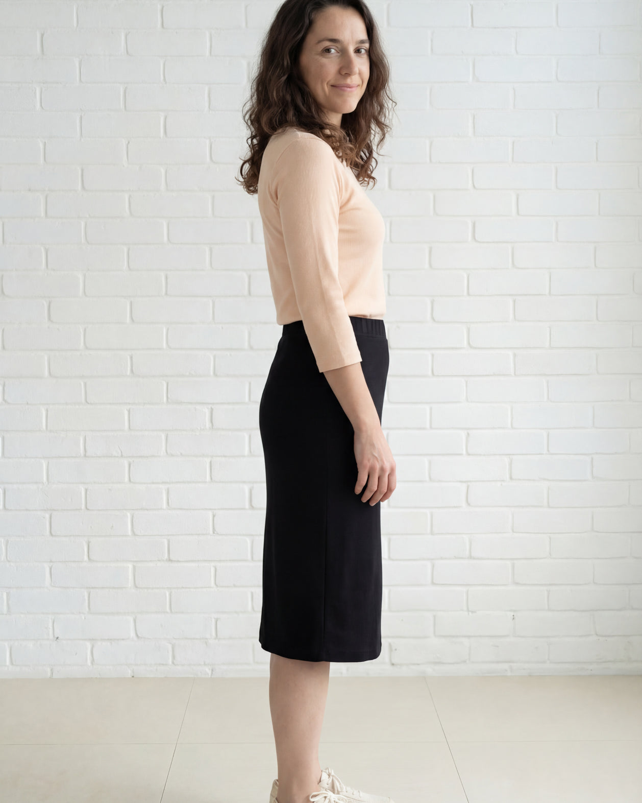Model wearing Nuggles® 27" Relaxed Midi Skirt in Black