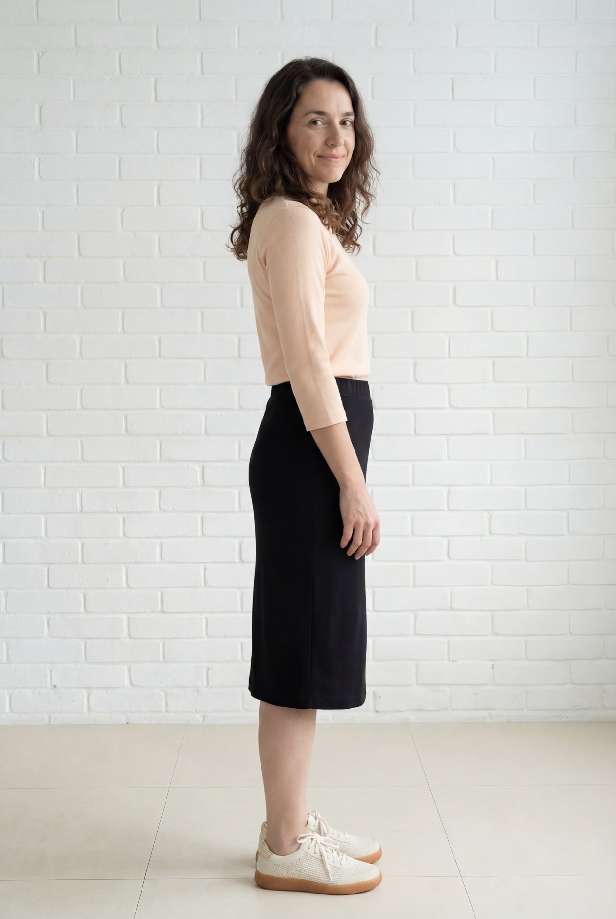 Model wearing Nuggles® 27" Relaxed Midi Skirt in Black