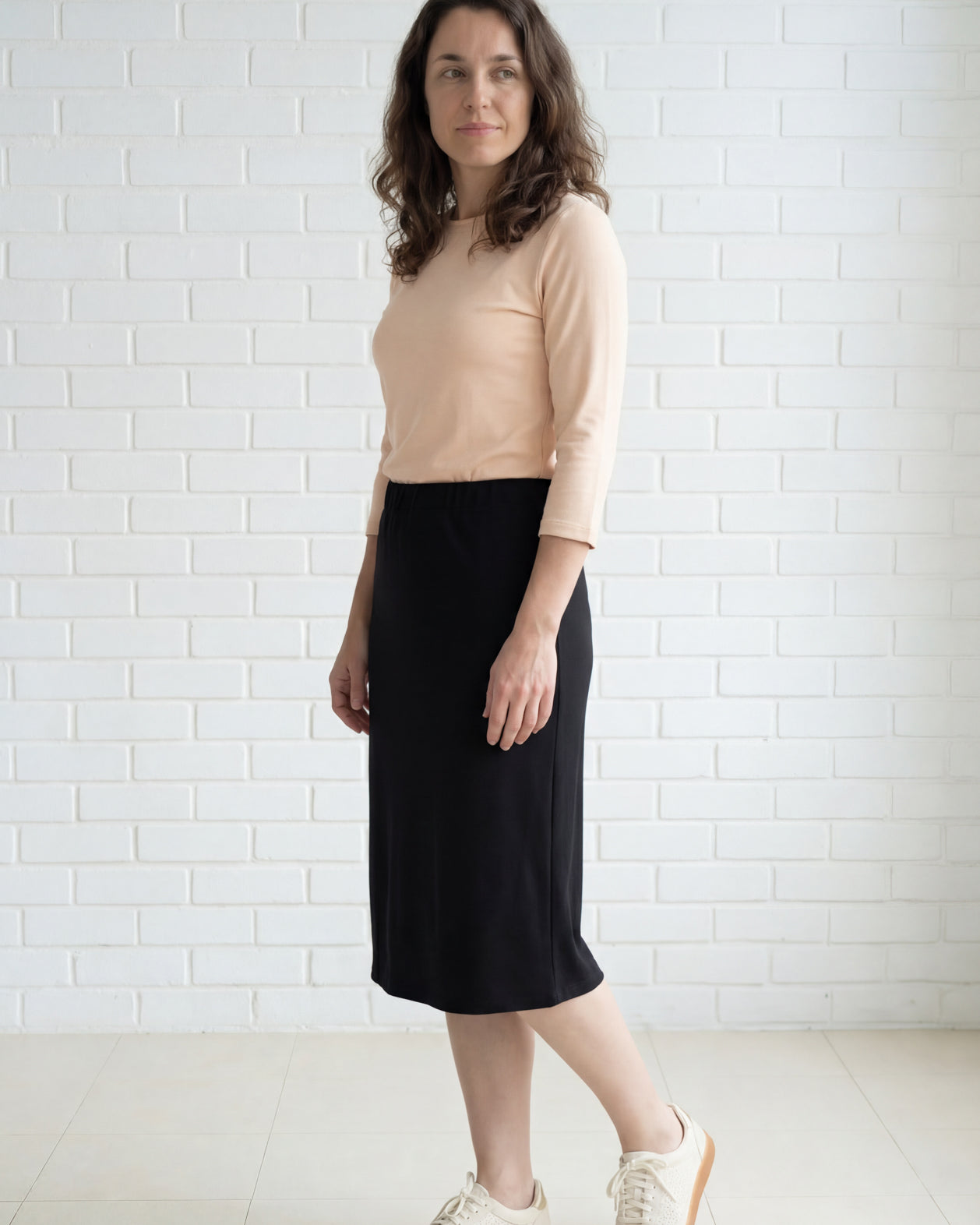 Model wearing Nuggles® 27" Relaxed Midi Skirt in Black
